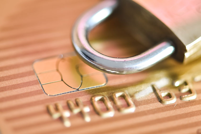 Padlock on top of a credit card