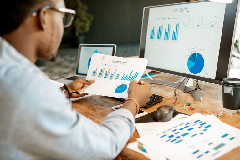 Professional looking at marketing reports