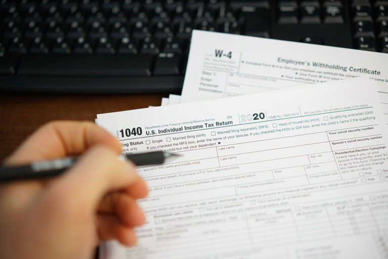 Woman filling out tax paperwork