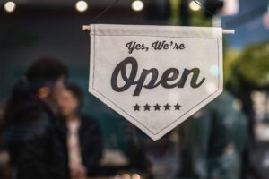 open sign on a door at a restaurant