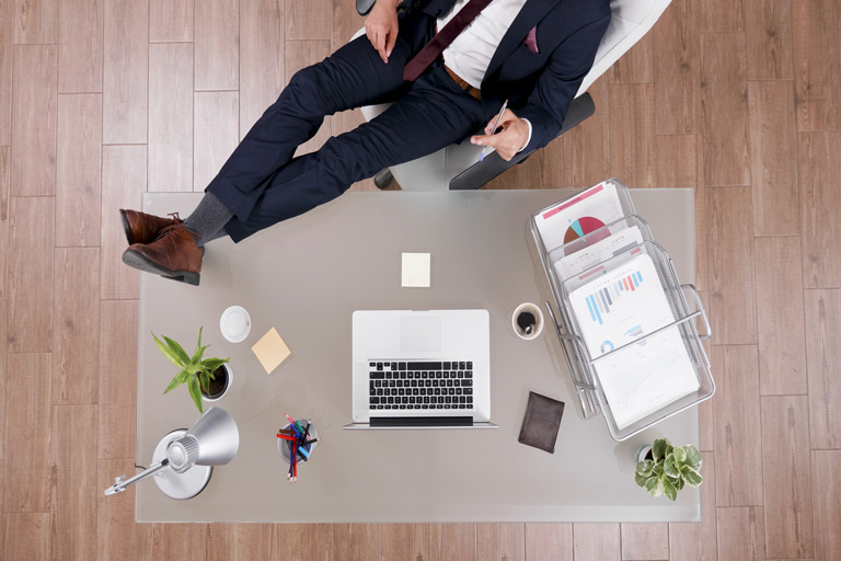 Businessman relaxing his feet on a table