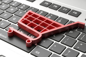 Shopping cart on top of a laptop