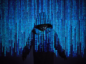 Programmer standing in front of a projector with coding