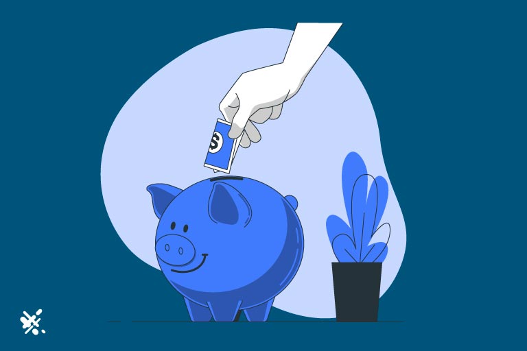 Hand putting cash inside a piggy bank