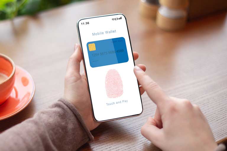 Someone using fingerprint recognition to use their mobile wallet