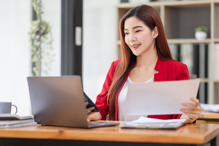 Smiling Asian woman working from home