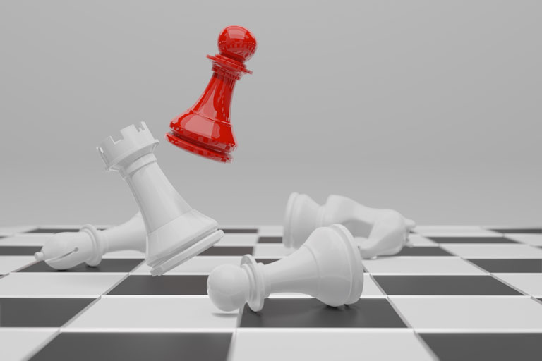 Red pawn jumping over White chess pieces falling on a chess board