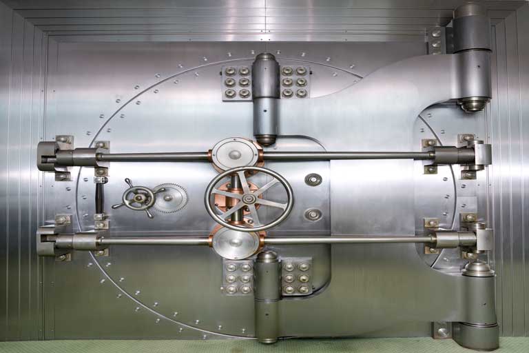 A closed door to a bank vault