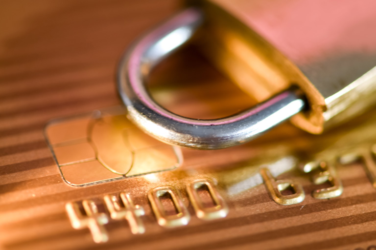 Padlock on top of a credit card