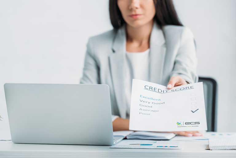 Woman handing out a credit score printout to a customer with the box poor checked