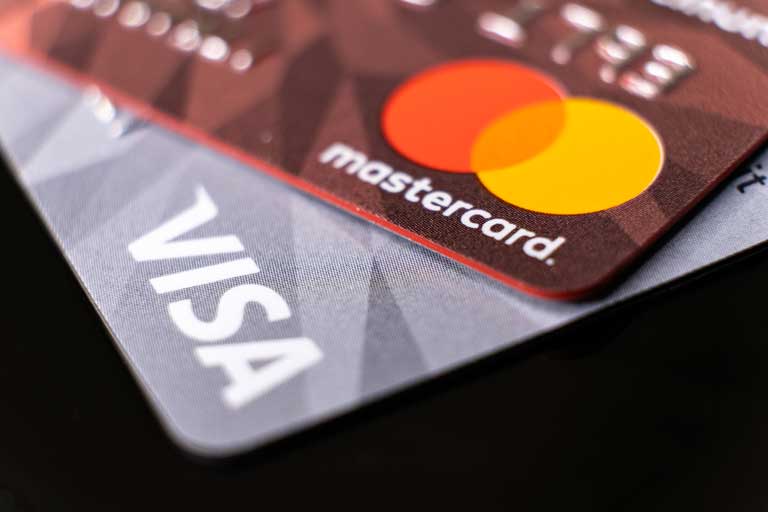mastercard and visa card on top of each other