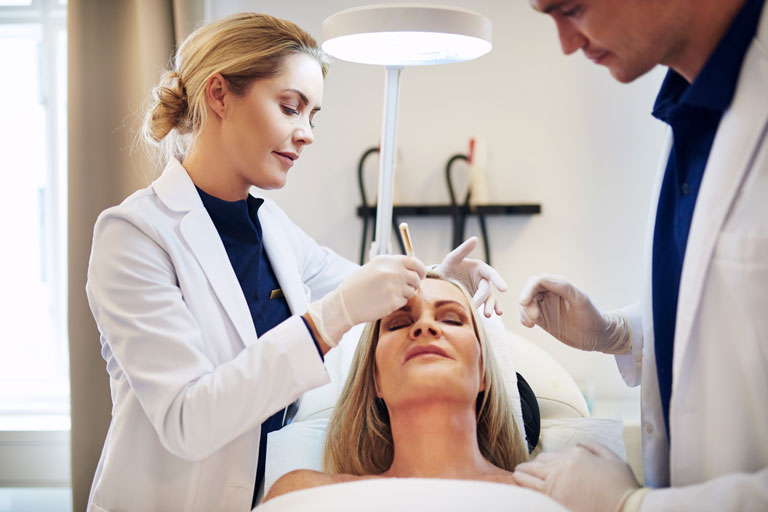 Woman getting cosmetic surgery at a clinic