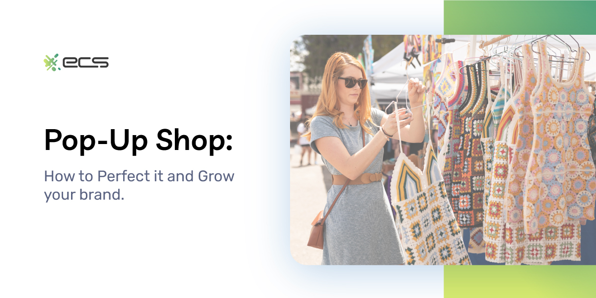 Picture of a woman holding a handmade dress at a pop up shop