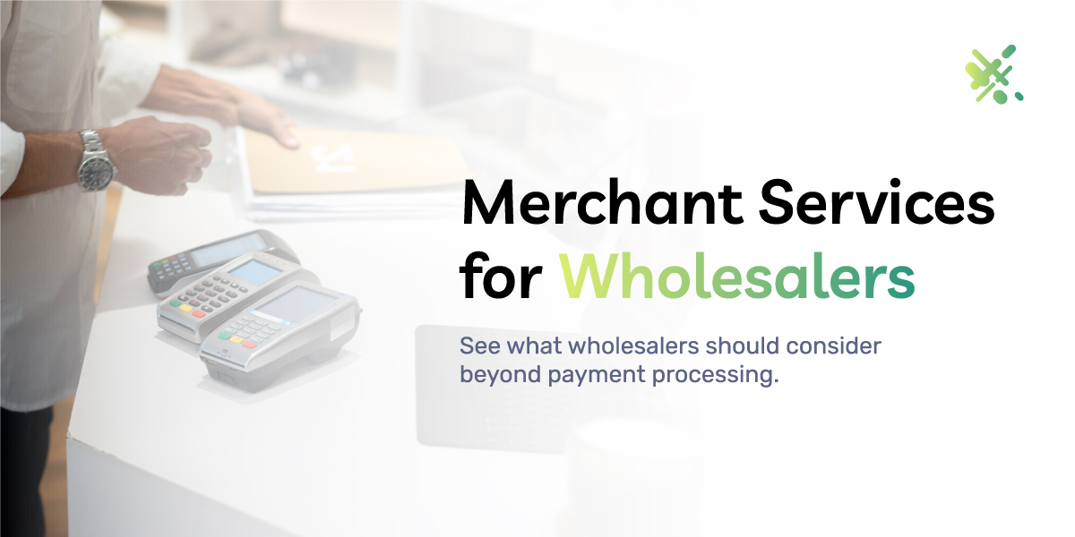 This picture shows a wholesale business owner looking at different payment terminals to use for his business